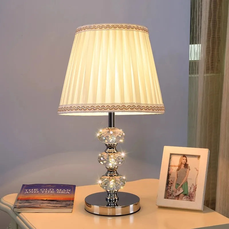 table lamp with a timeless cream-colored pleated fabric shade.