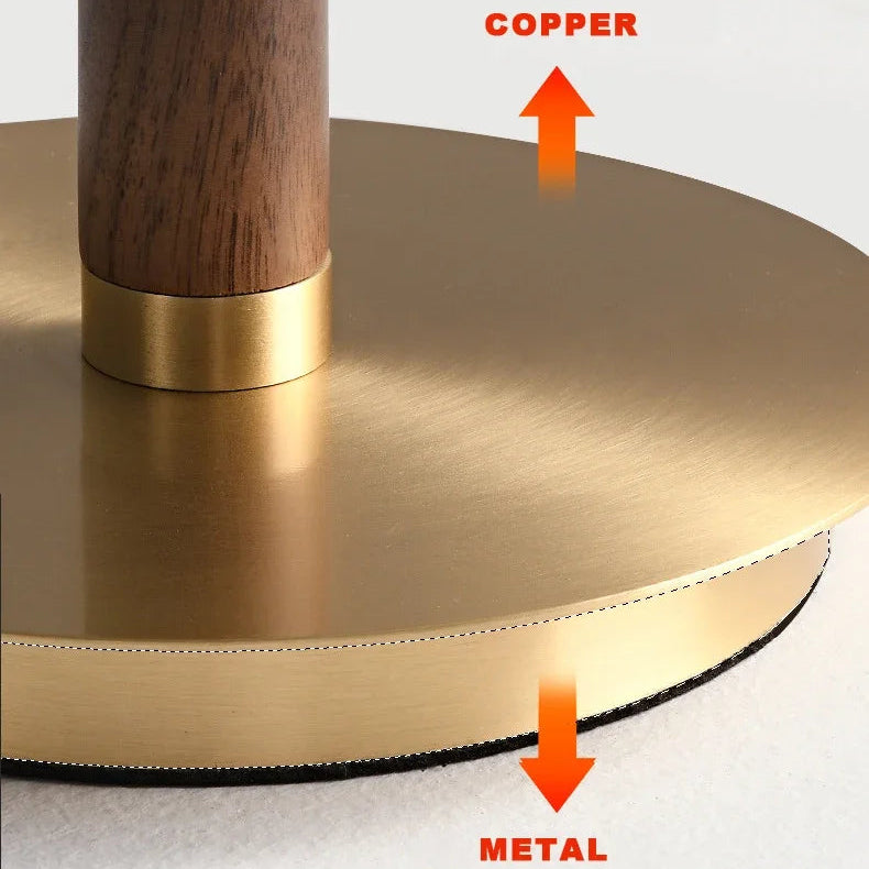 Slim copper stem and weighted metal base detail