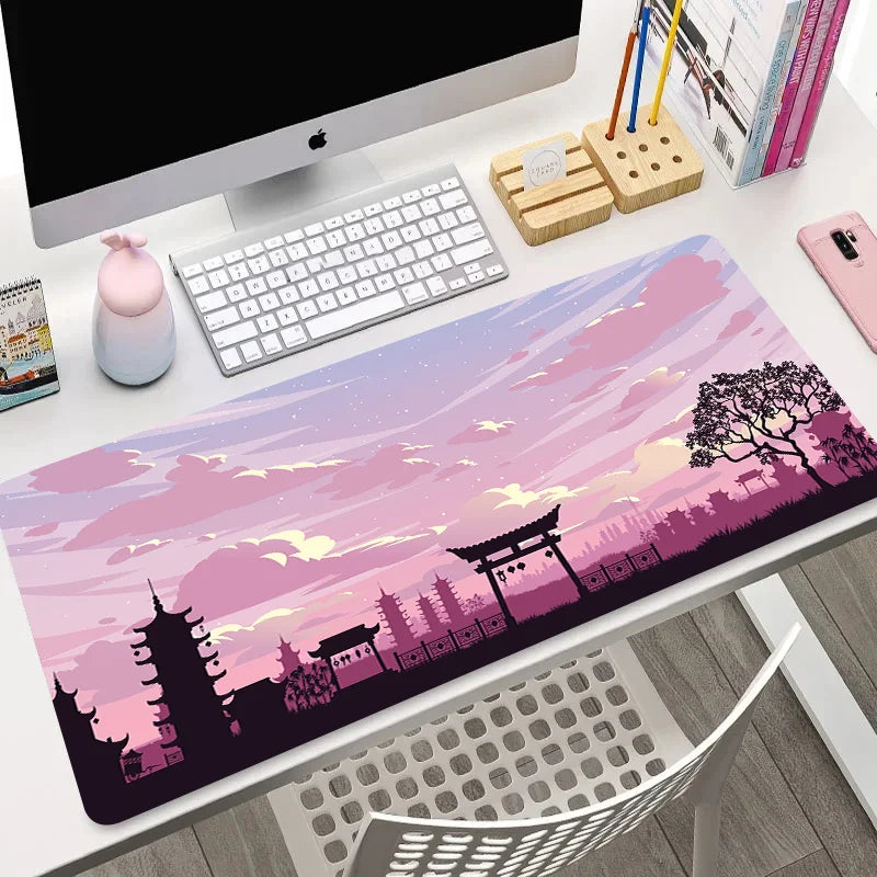 Wide mouse pad with pink twilight temple silhouette and soft pastel sky, shown flat and rolled