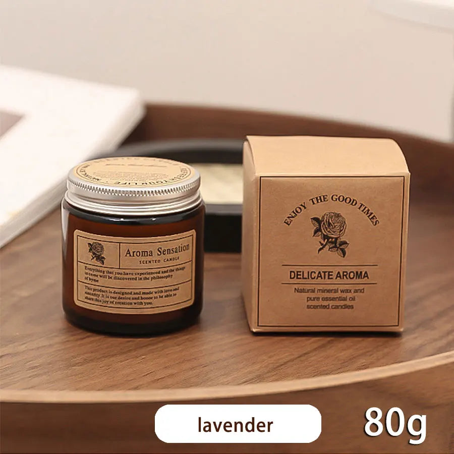 Aroma Sensation candle with packaging on a wooden surface