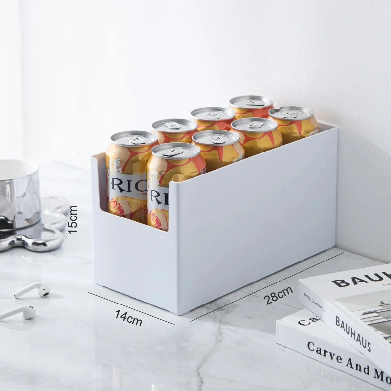 White can holder with orange and white cans on a marble surface with measurements shown.