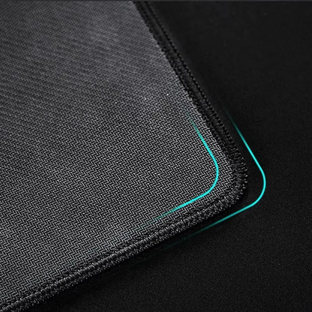Close-up of a textured mouse pad with a black background