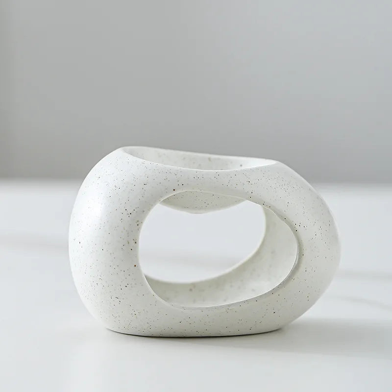 White ceramic incense burner on a gray background