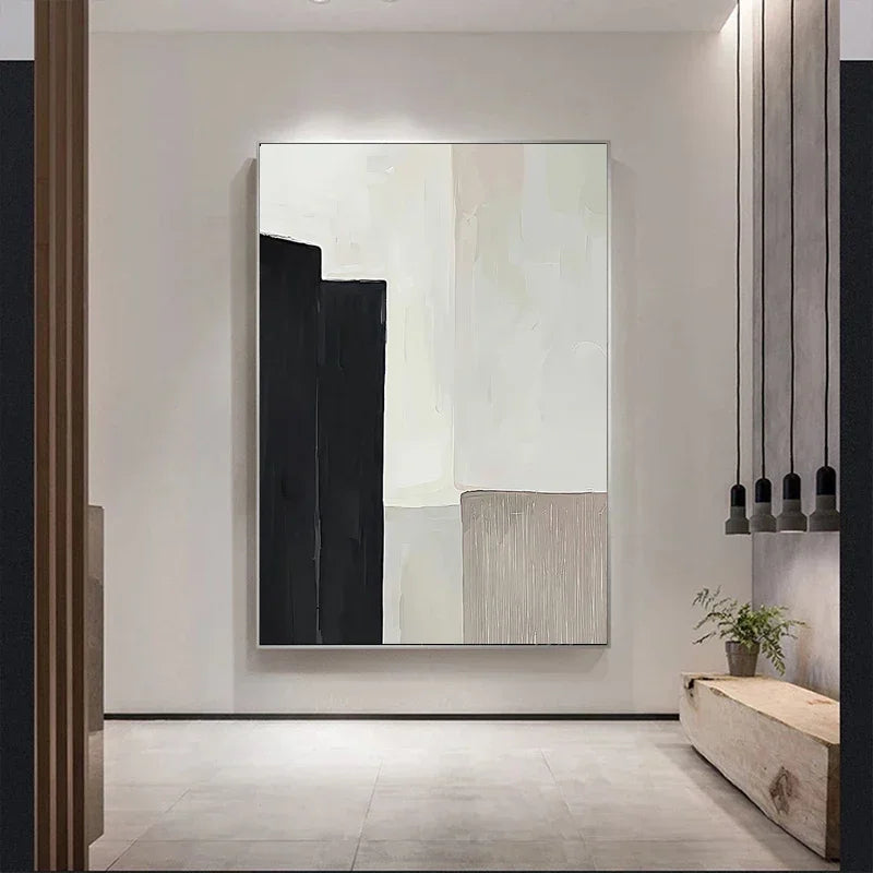 Minimalist abstract canvas print with bold black shape, soft cream tones, and a textured beige panel.