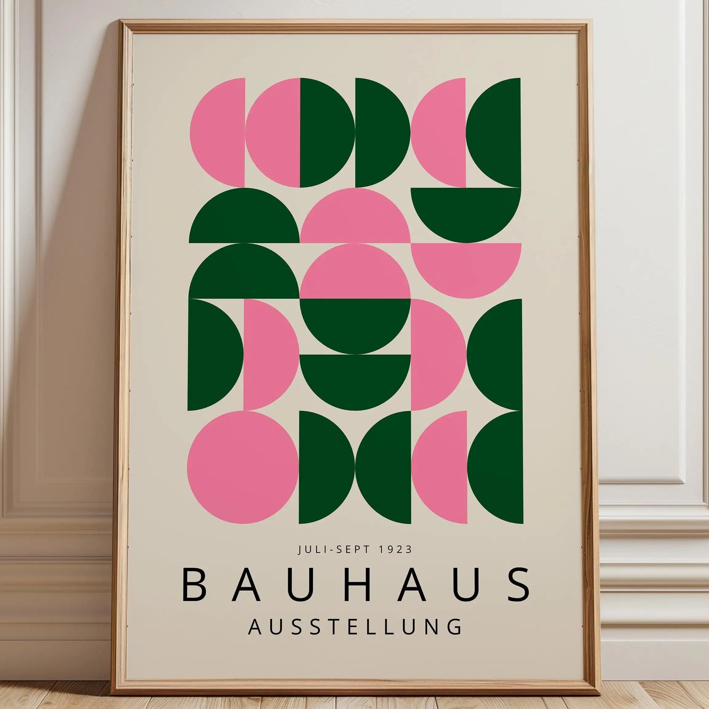 Framed Bauhaus poster with geometric design on a wall.