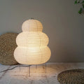A stylish Japanese lamp on a neutral background with wicker baskets