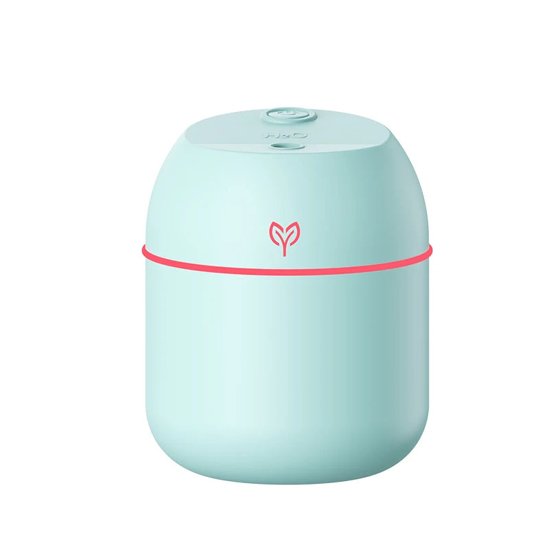 Mint green humidifier with a red accent on a white background