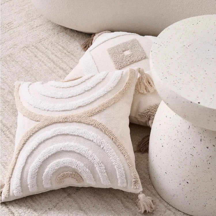 Decorative pillow with rainbow pattern on a textured surface