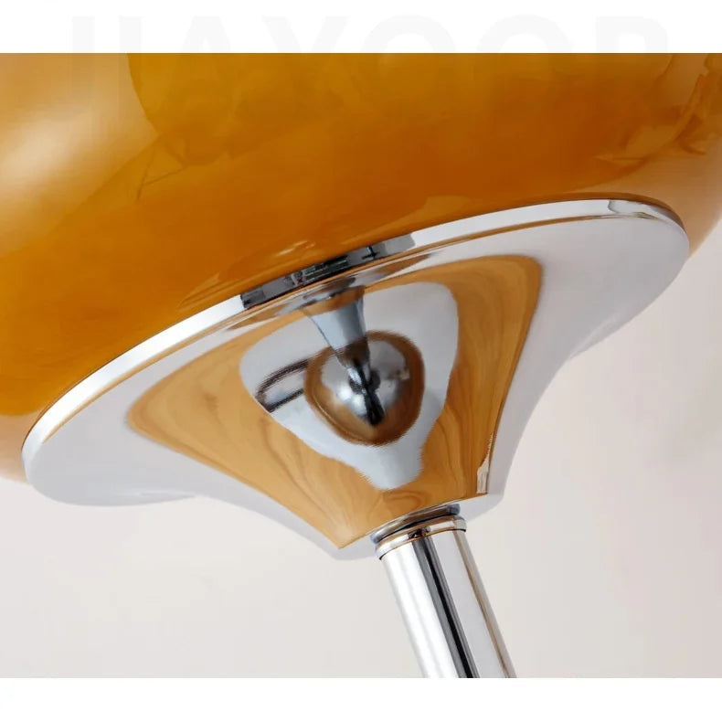 Close-up of a lamp with text about iron plating and product details.