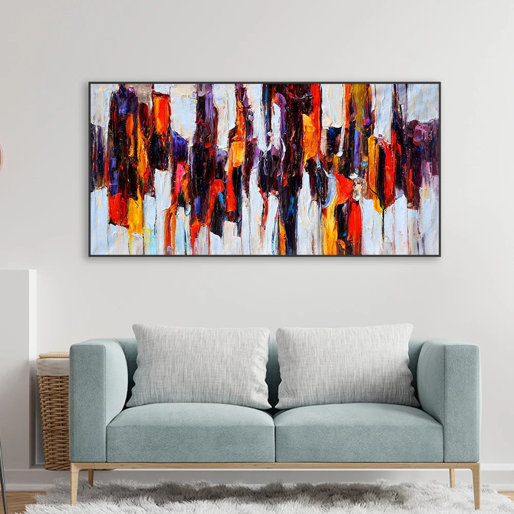 Abstract painting above a sofa in a living room setting