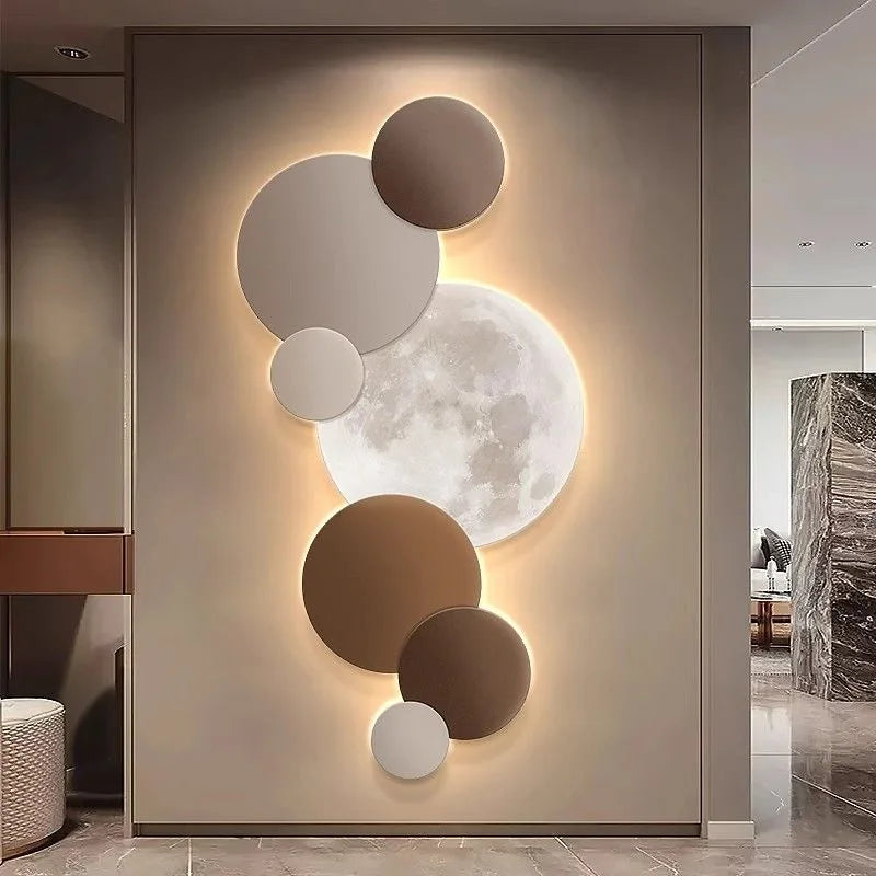 Terracotta and taupe moon wall light illuminating a hallway entrance