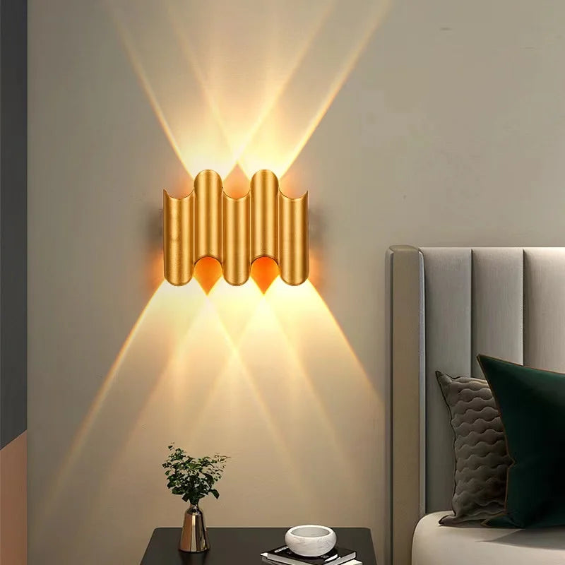 Gold 3-wave creative wall light with sculptural aluminium body and layered warm beam projection