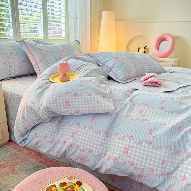 Cottage Rose bedding set showing a mix of sky blue and soft pink floral lace patterns.