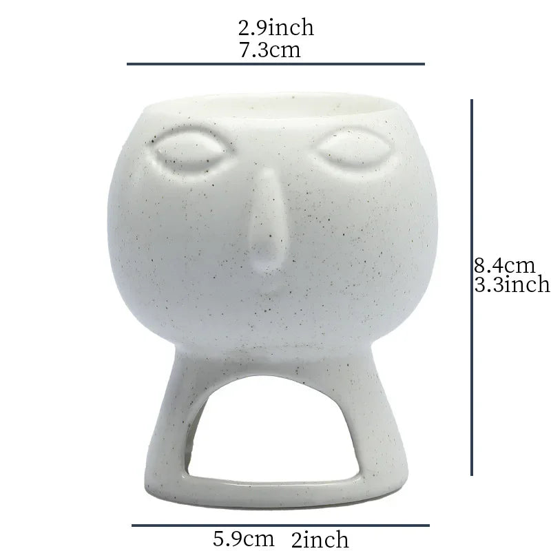 White ceramic face incense burner with dimensions indicated on a white background