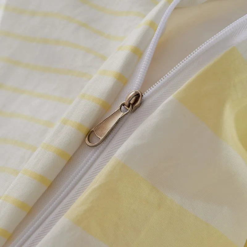 Close-up of a yellow and white striped fabric with a zipper