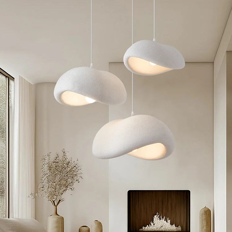 Three Wabi-Sabi pebble pendant lights hanging in a cluster with a size guide