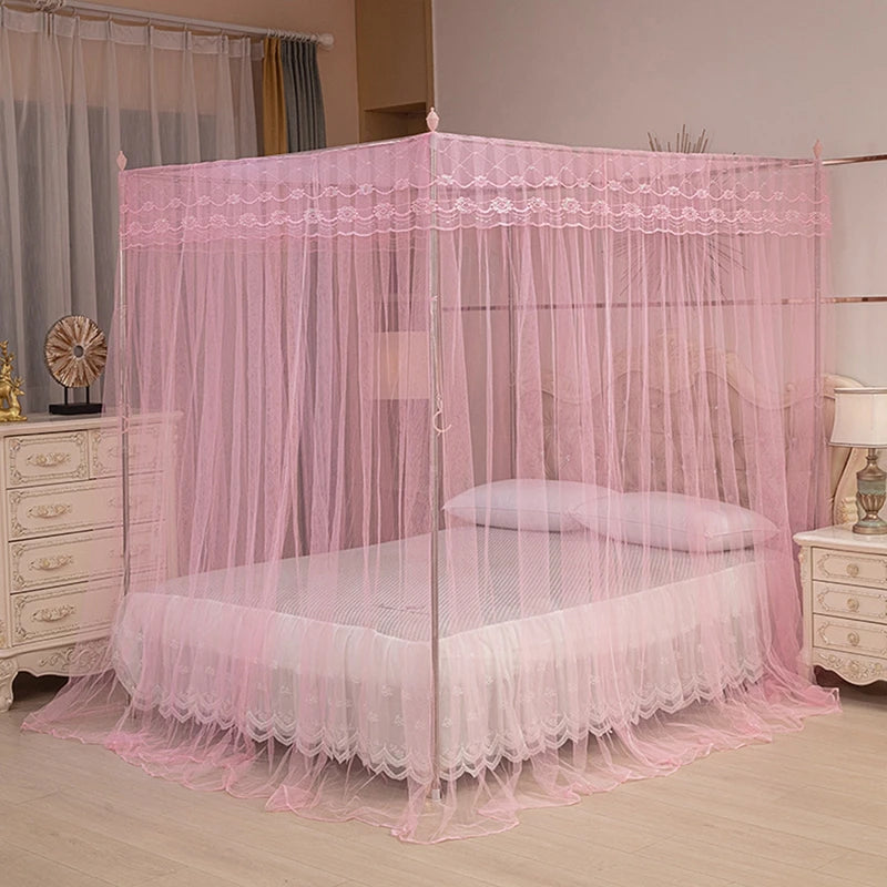Pink four-poster lace canopy mosquito net draped over a bed