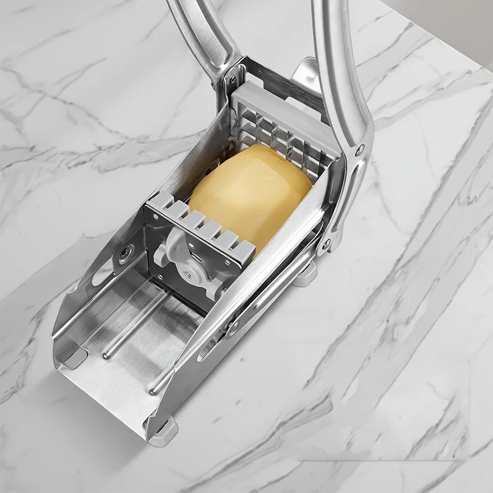 Top view of a manual food cutting machine with a potato inside the cutting grid