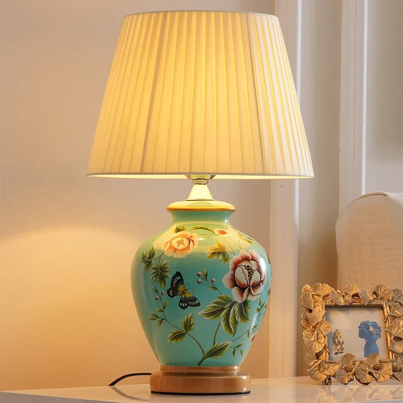 Decorative table lamp with floral design on a light background