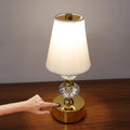 Gold crystal-style table lamp with white fabric shade, 29.5cm