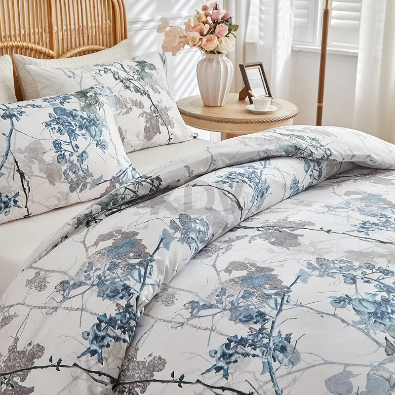 White duvet cover set with blue and taupe branch floral print and matching pillowcases