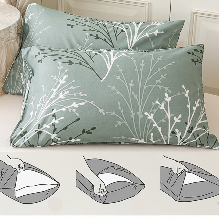 Floral patterned pillowcases with envelope closure design on a bed.