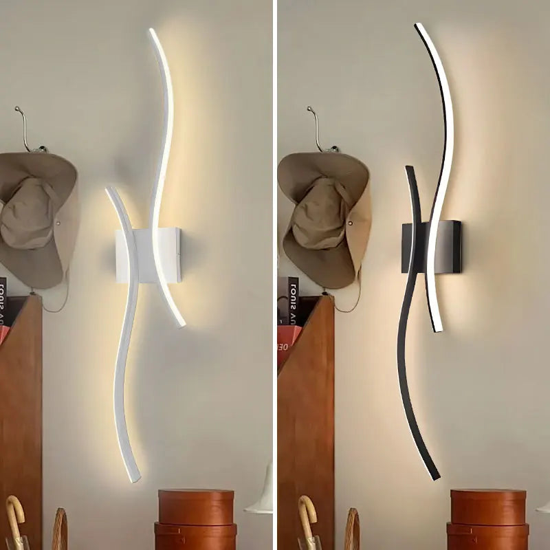 Two wall-mounted lights with different finishes on a neutral background.