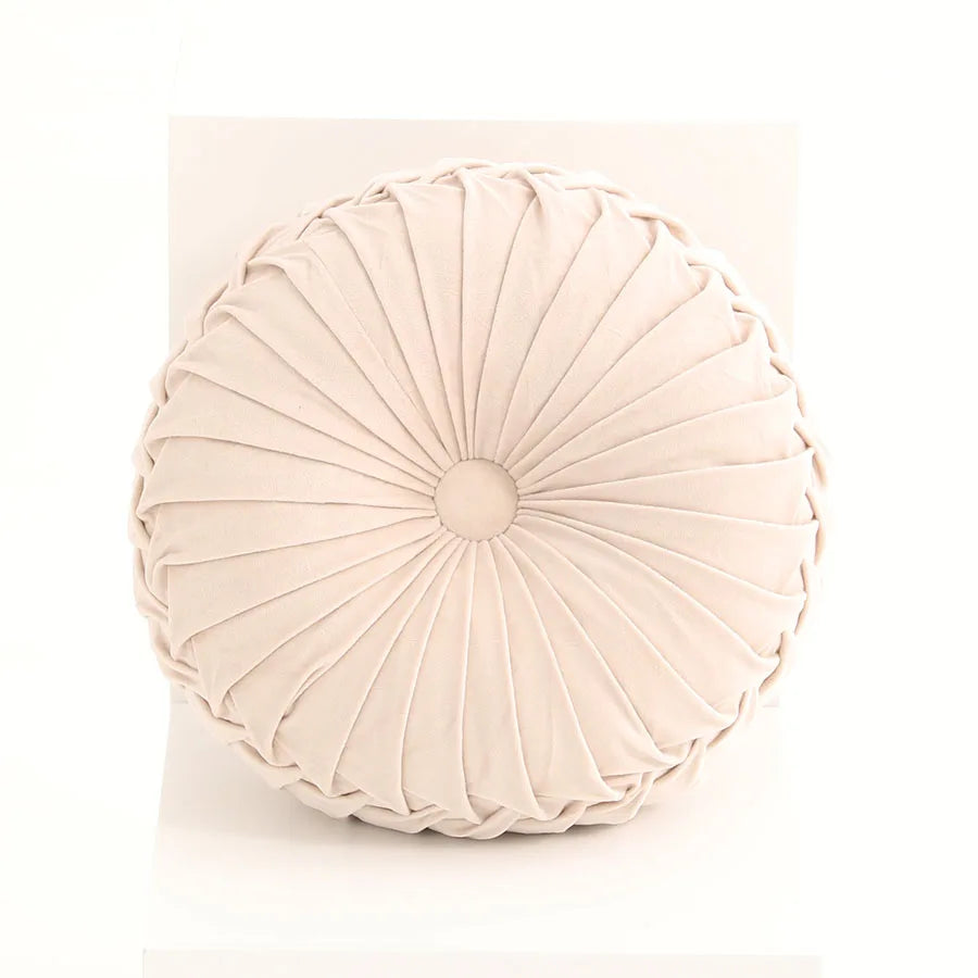 Round pleated cushion on a white background