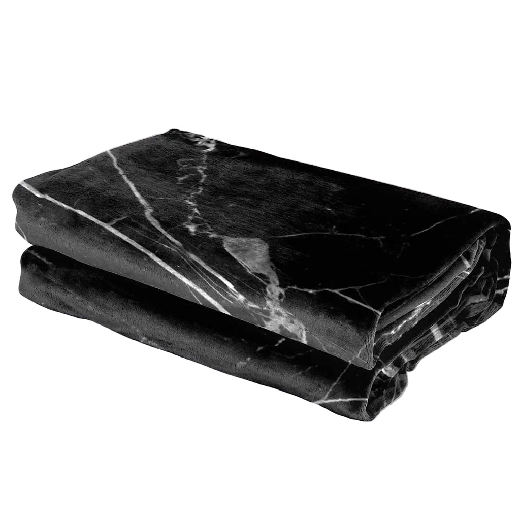 Black marble-patterned blanket on a white surface