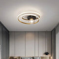 Close-up of black double-spiral LED ceiling light with textured amber glass globe against a white ceiling
