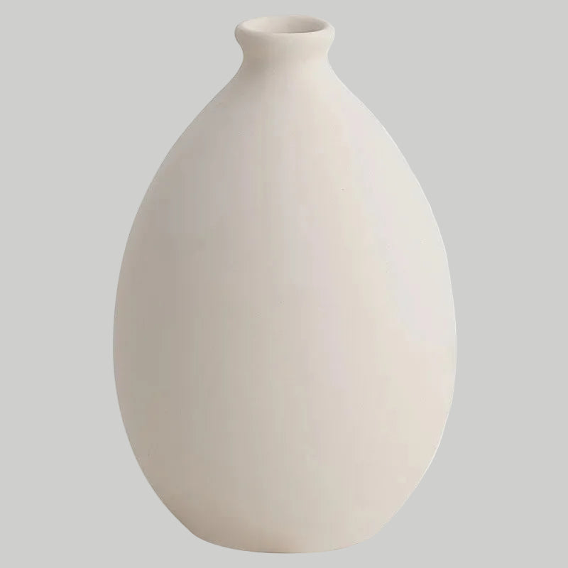 White ceramic vase on a white background