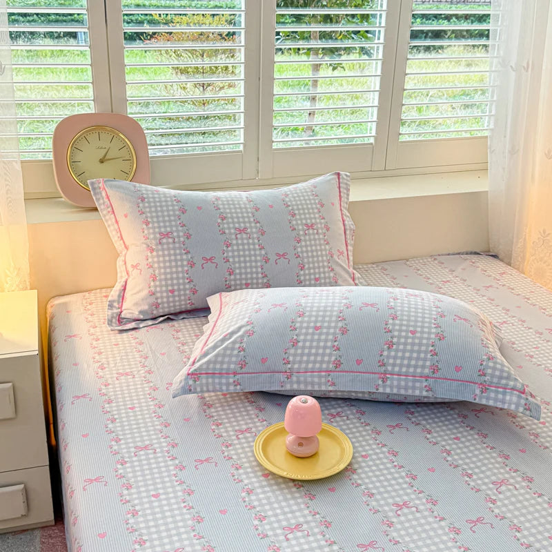Cottage Rose bedding set showing a mix of sky blue and soft pink floral lace patterns.