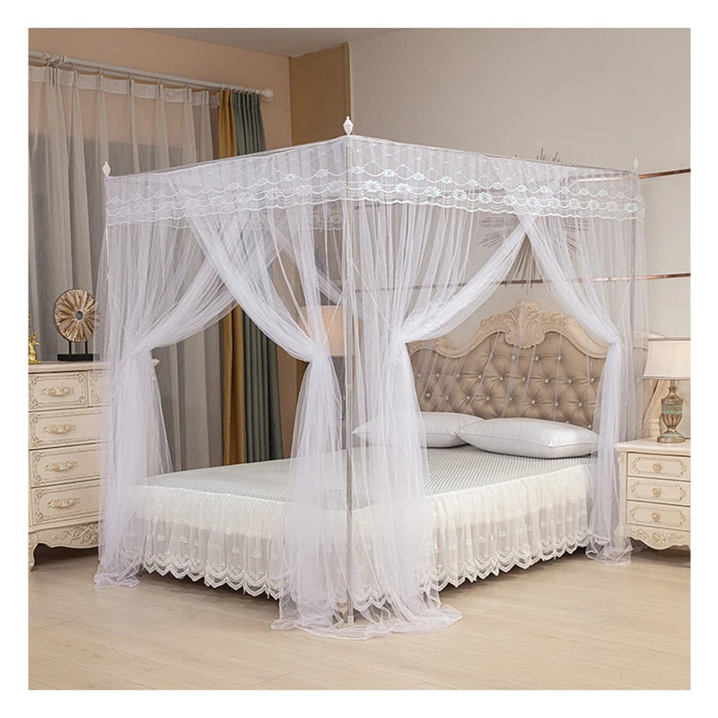 White four-poster lace canopy mosquito net draped over a bed