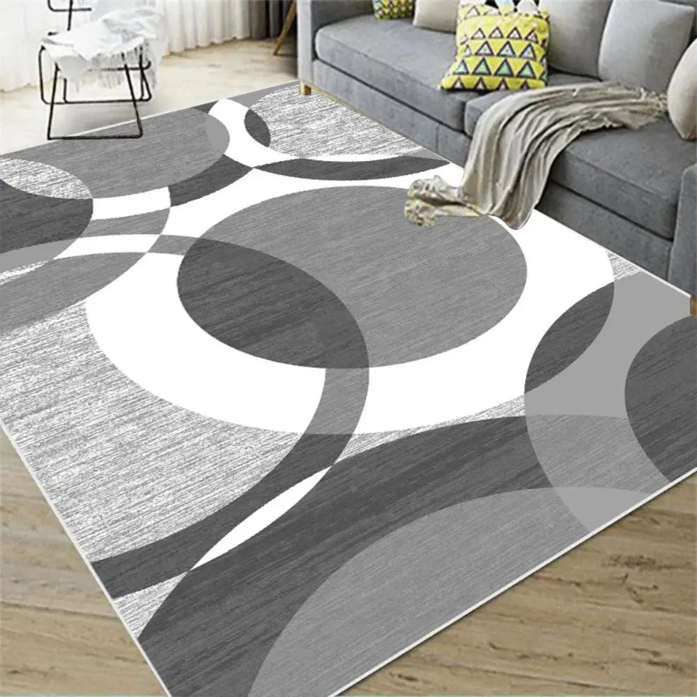 Grey and white Nordic geometric rug with overlapping circle pattern.