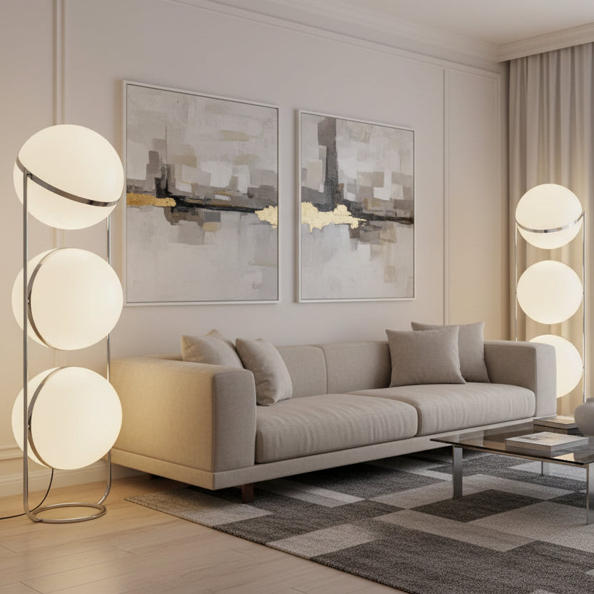 Modern floor lamp with spherical white shades in a room setting. Triple Globe Floor Lamp