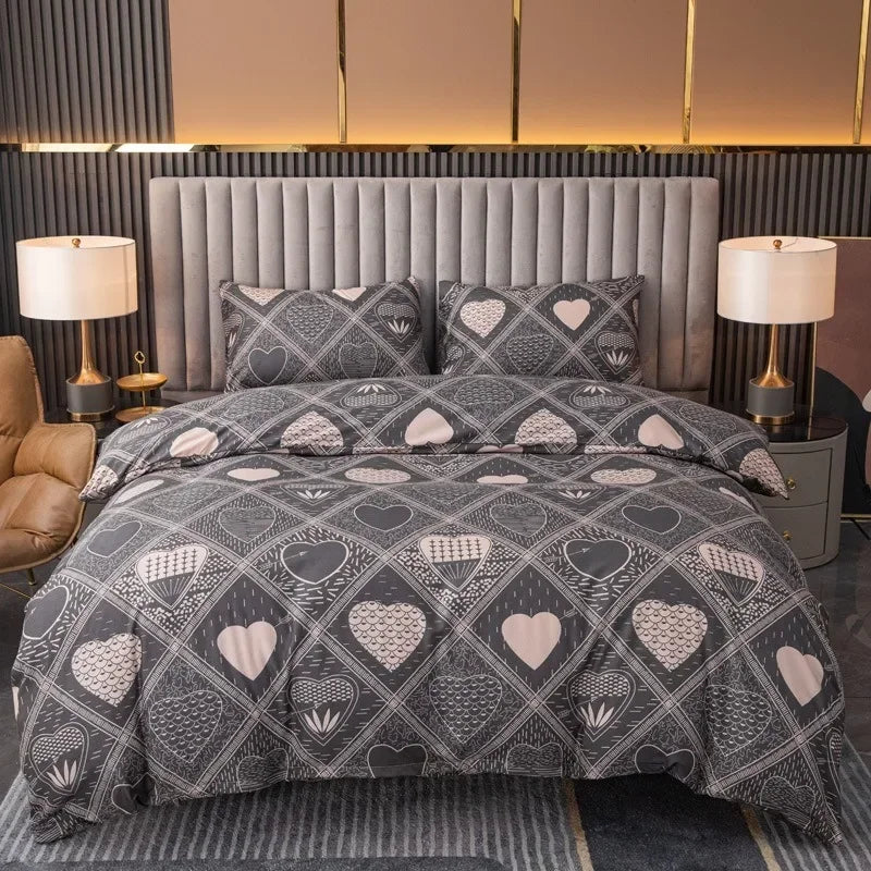Grey bedding set with a patchwork heart pattern and matching pillowcases