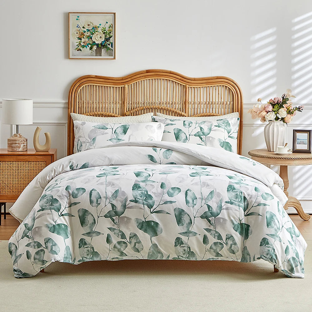 White duvet cover set with green eucalyptus leaf print and matching pillowcases
