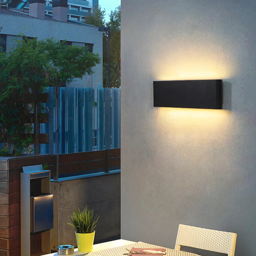 Black 20W LED wall light with warm white glow
