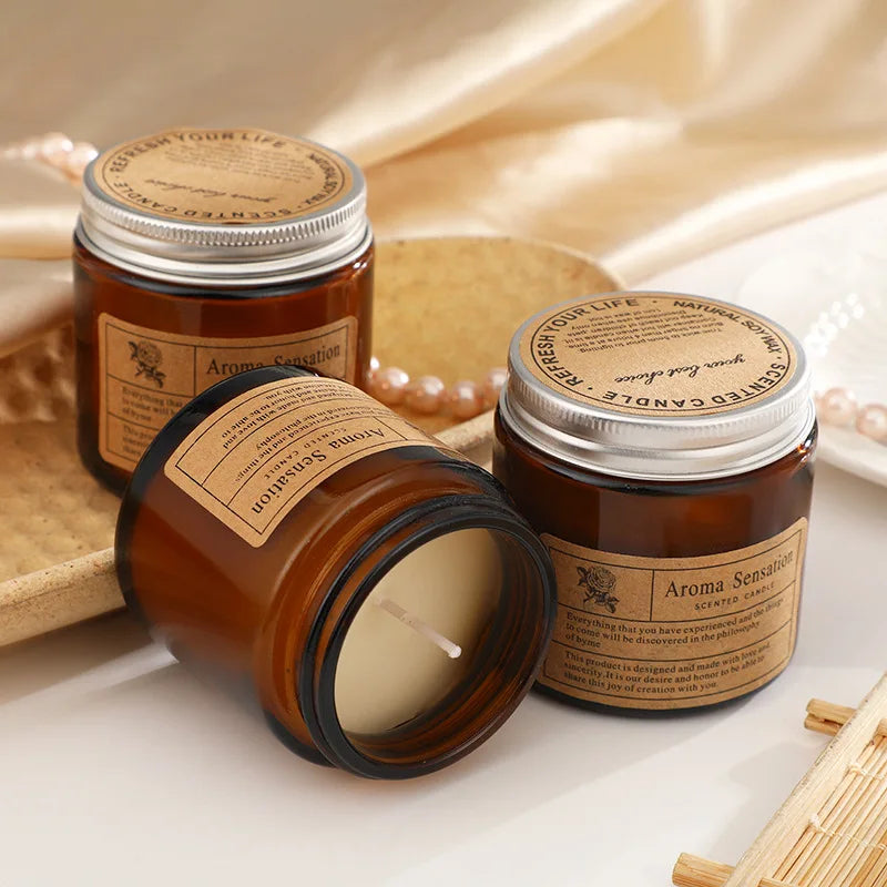 Three Aroma Sensations candles on a light background