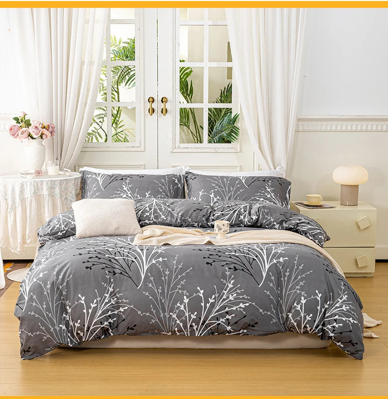 Grey 3-piece polyester bedding set with white botanical branch print and matching pillowcases