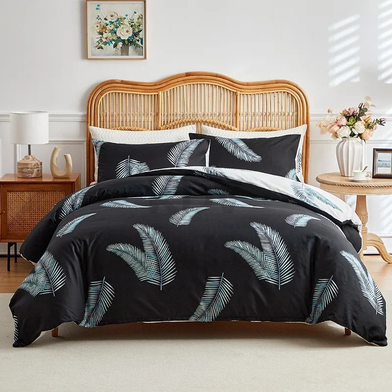 Black duvet cover set with white tropical palm leaf print and matching pillowcases