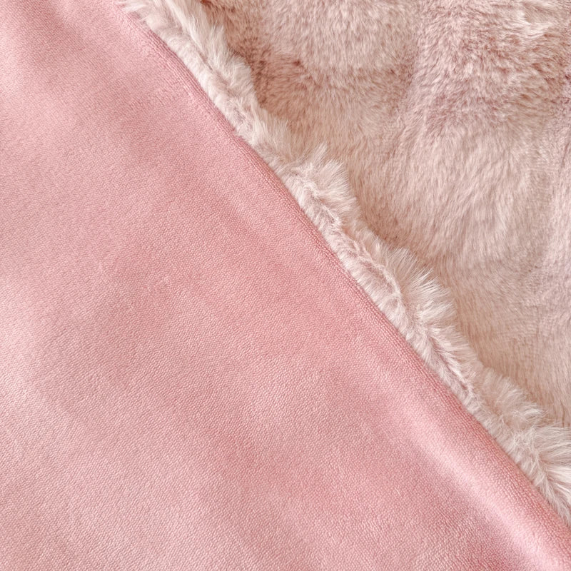 Close-up of pink fabric with a fluffy texture