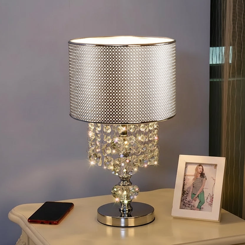 Luxury crystal pendant-style lamp with a silver perforated shade and hanging crystal beads.
