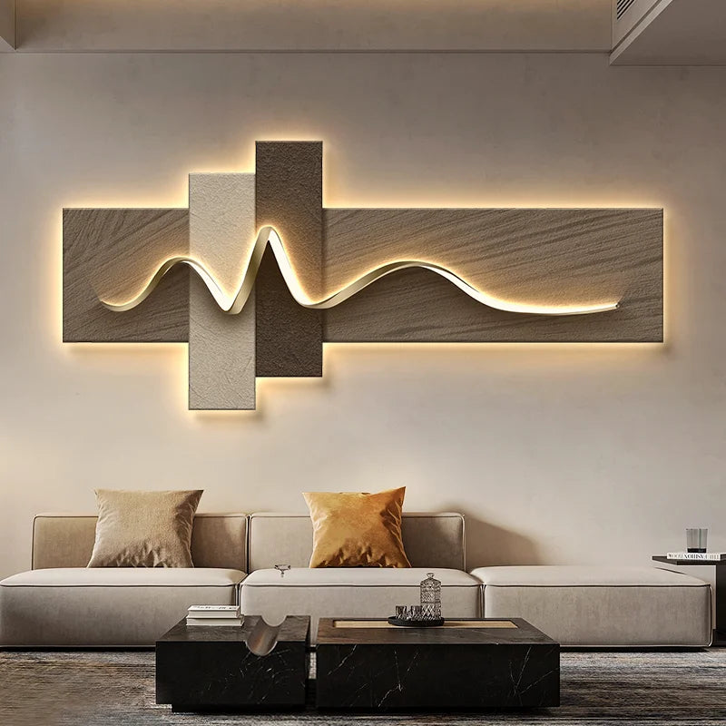 Modern living room with a decorative wall light art piece and a sofa.