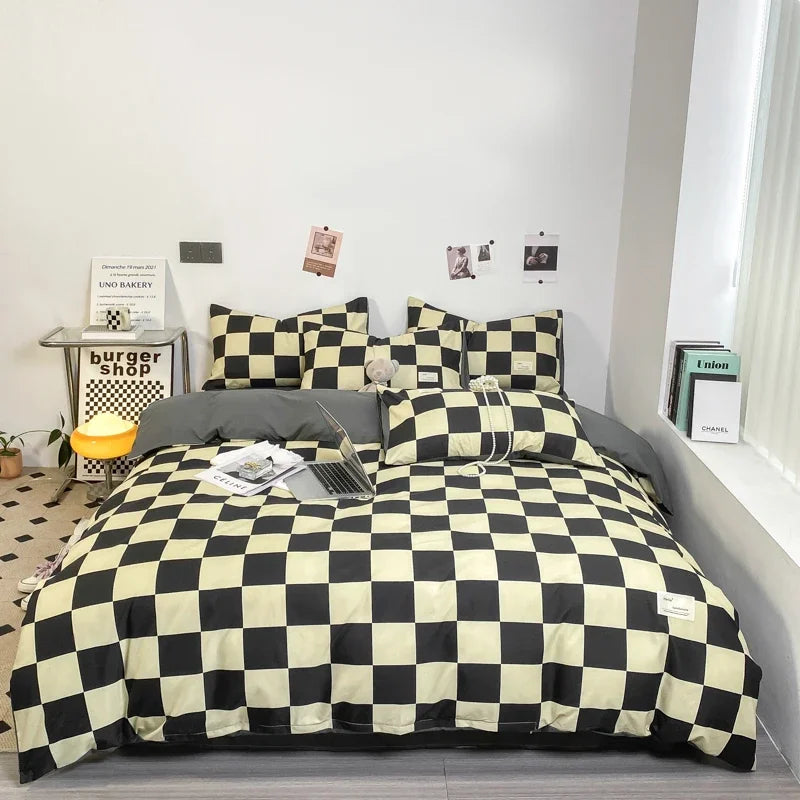 Black and sage checkerboard duvet cover set with matching pillowcases dressed on a double bed in a modern styled bedroom