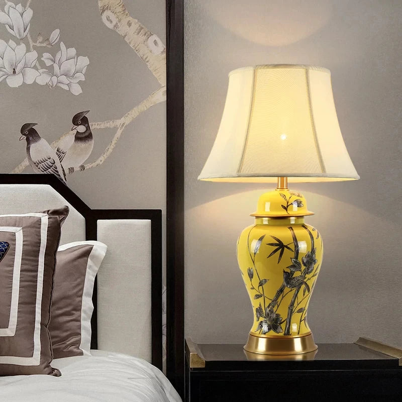 Tall yellow ceramic floral table lamp with a white fabric shade and a height of 68 cm