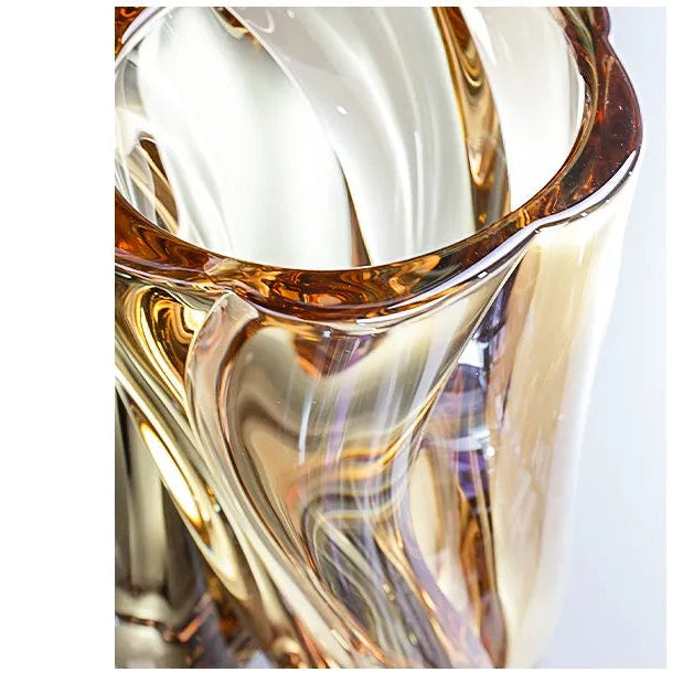 Sunset amber crystal glass vase featuring a rich golden gradient and spiralled texture.