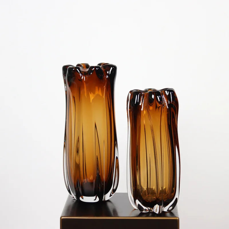 Two thick amber crystal glass vases in small and large sizes, featuring organic wavy rims and vertical textures.