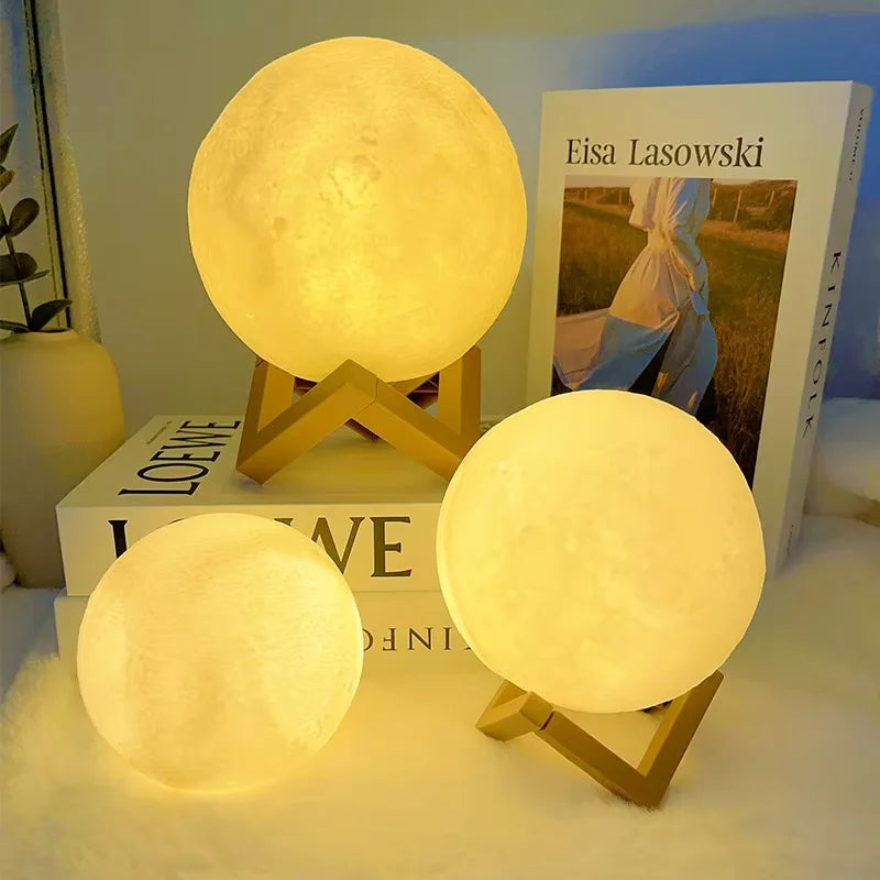 Three moon-shaped lamps on stands.