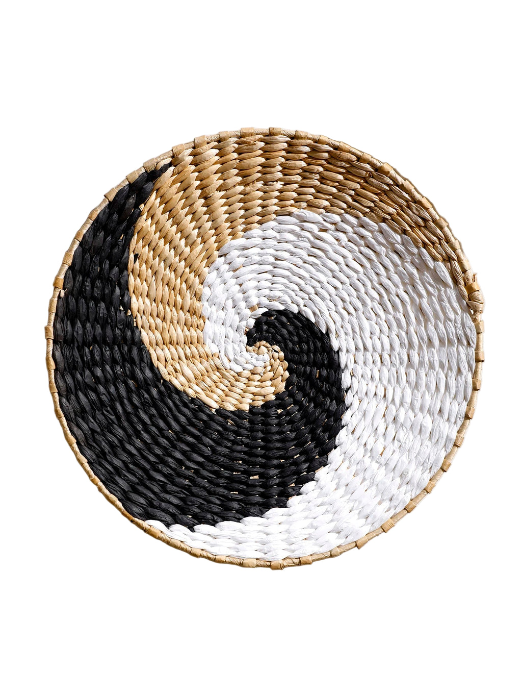 Round woven coaster with black, beige, and white pattern on a light background